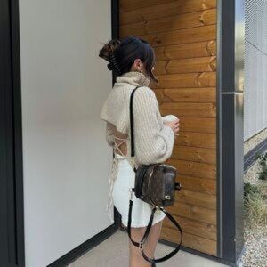 Turtle neck open back sweater